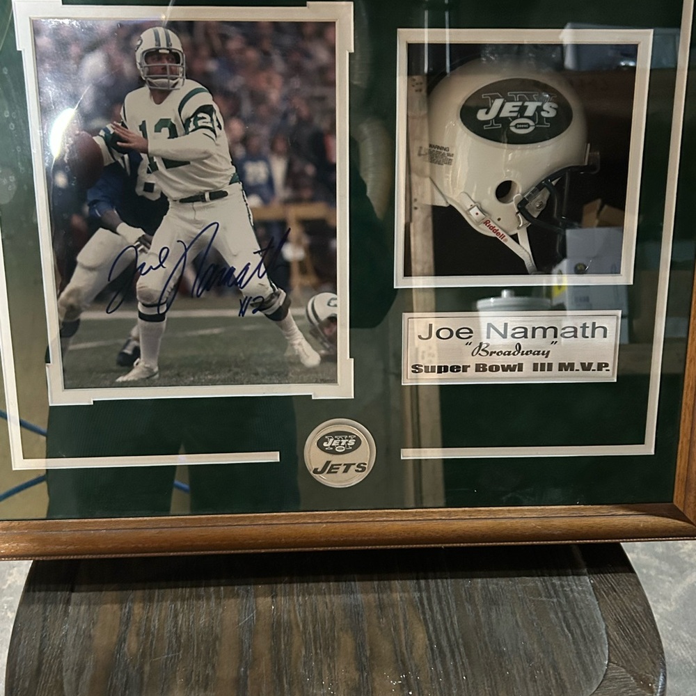 The Jets Joe Namath Autographed picture with rep helmet